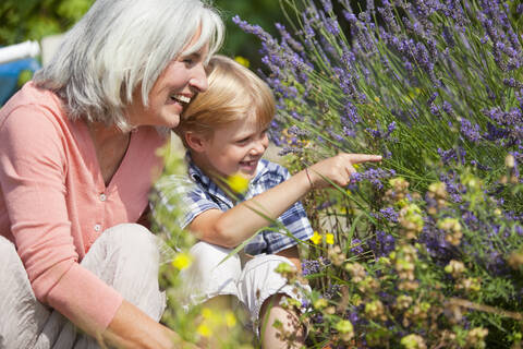 Germany, Bavaria, Mature woman with boy in garden stock photo