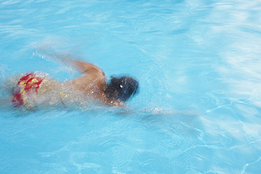 Germany, Mature woman swimming in pool - JTF000030