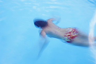 Germany, Mature woman swimming in pool - JTF000031