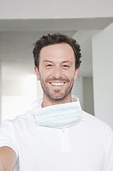 Germany, Dentist smiling, portrait - FMKYF000185
