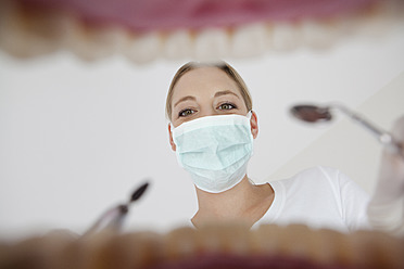Germany, Dentist with dental equipment in dental office - FMKYF000217
