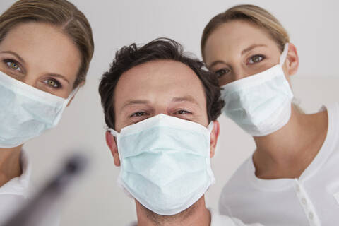 Germany, Dentist with surgical mask, portrait stock photo