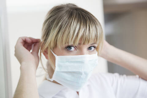 Germany, Dentist with surgical mask stock photo
