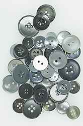 Variety of buttons on white background, close up - ASF004632