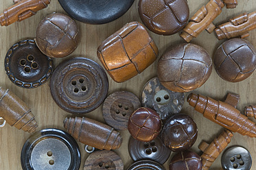 Variety of buttons on table, close up - ASF004635