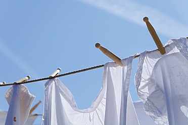 Germany, Bavaria, Drying clothes on washing line - TCF002887