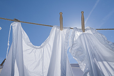 Germany, Drying clothes on washing line - TCF002892