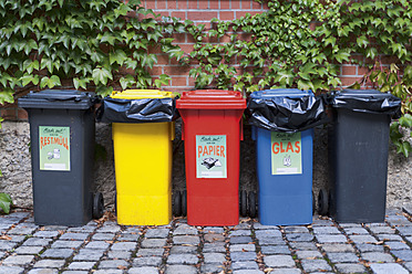 Germany, Munich, Various garbage containers in yard - TCF002950