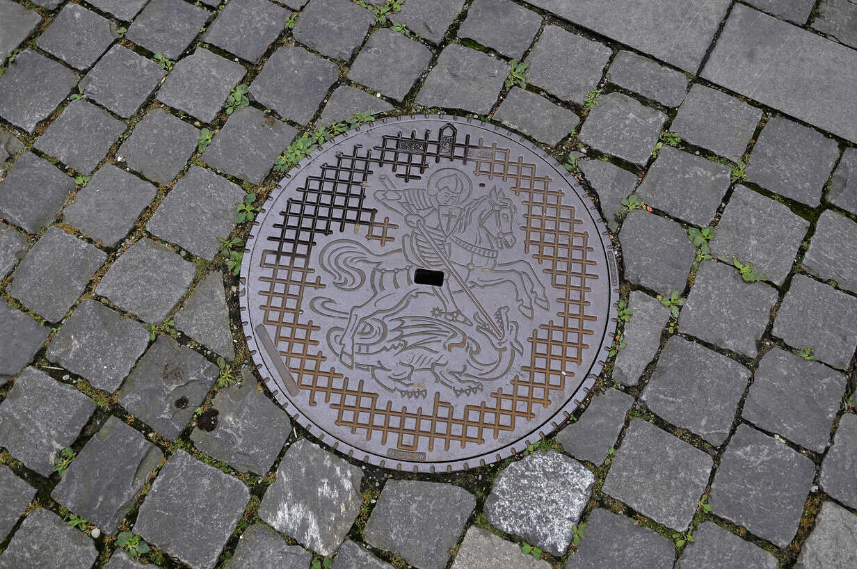 https://us.images.westend61.de/0000181435pw/switzerland-manhole-cover-with-knight-and-horse-AXF000346.jpg