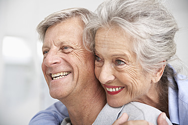 Spain, Senior couple looking away, smiling - PDYF000161