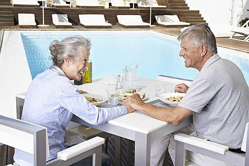 Spain, Senior couple having lunch at Mallorca - PDYF000164