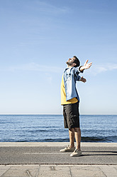 Spain, Mid adult man standing at Atlantic Ocean - WESTF018974