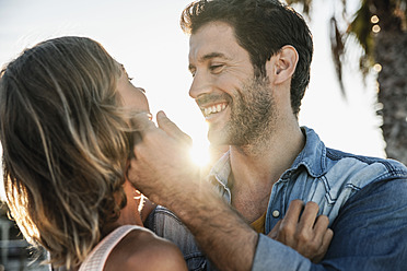 Spain, Mid adult couple embracing, smiling - WESTF019007