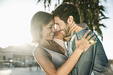 Spain, Mid adult couple embracing, smiling - WESTF019008