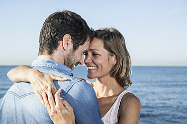 Spain, Mid adult couple embracing, smiling - WESTF019023