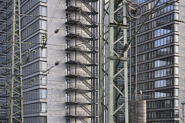 Germany, Bavaria, Munich, Railway power line in front of Telekom center building - AXF000369