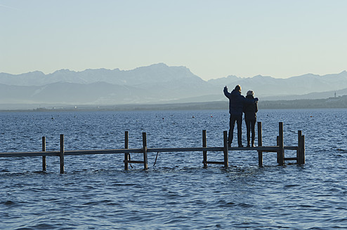 Europe, Germany, Bavaria, Man and woman relaxing at Lake Ammersee - CRF002208