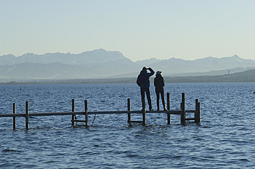 Europe, Germany, Bavaria, Man and woman relaxing at Lake Ammersee - CRF002207