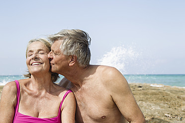 Spain, Senior man kissing to woman, close up - JKF000121