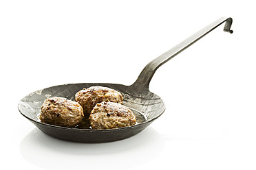 Fried meat balls in iron pan on white background - MAEF005336