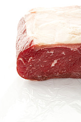 Raw beef on white background, close-up - MAEF005375