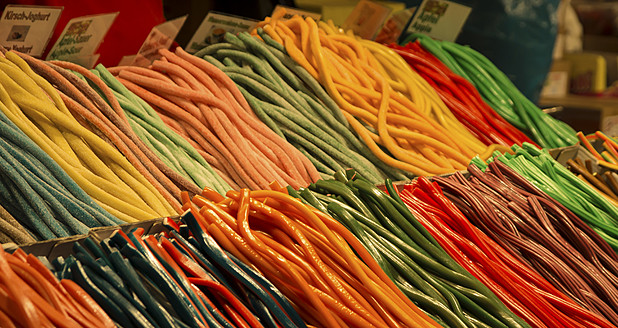 Germany, Frankfurt, Candy canes at christmas market - DJGF000011
