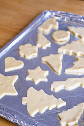 Various cookies shape on foil, close up - ABAF000568