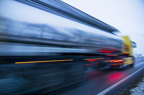 Austria, Cargo truck moving on country road in winter - EJWF000162