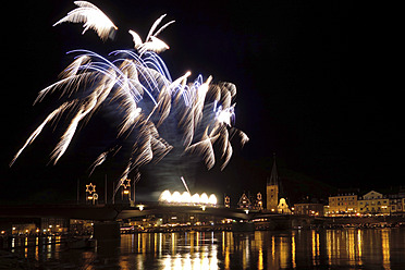 Germany, Fireworks exploding on bridge at River Mosel - HOHF000031