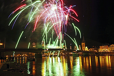 Germany, Fireworks exploding on bridge at River Mosel - HOHF000032