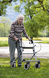 Austria, Senior woman pushing walking frame - WWF002466