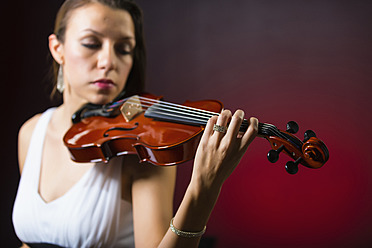 Young woman holding violin - ABAF000676