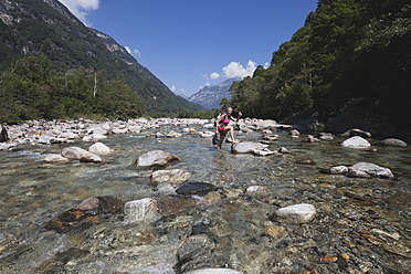 Europe, Switzerland, Mature woman hiking at Verzasca River - GWF002072