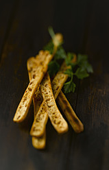 Breadsticks on wooden table, close up - KSWF001020