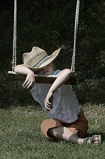 Austria, Boy sleeping on swing - CWF000003