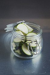 Pieces of zucchini in glass jar, close up - EVGF000022