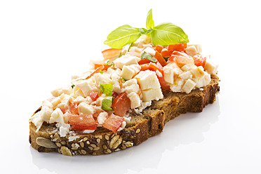 Mozzarella, tomatoes and basil on whole grain bread, close up - MAEF005609