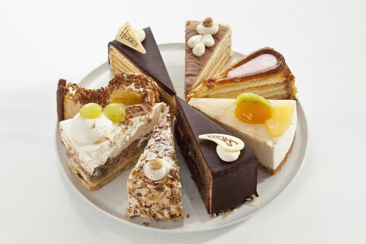 Closeup of a showcase with a variety of cakes in a german restaurant. The  cake is a form of sweet food made from flour, sugar, and other ingredients  Stock Photo - Alamy