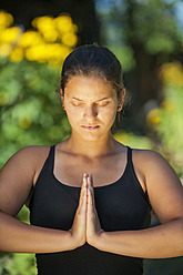 Austria, Salzburg Country, Young woman doing meditation - HHF004333