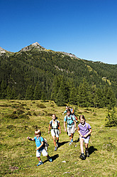 Austria, Salzburg, Family walking on mountains at Altenmarkt Zauchensee - HHF004363
