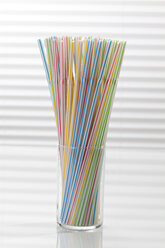 Glass of variety of drinking straws on white background, close up - CSF016649