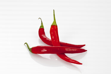 Red chili peppers on white background, close up - CSF016698