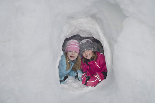 Austria, Girls in igloo, smiling - CWF000007