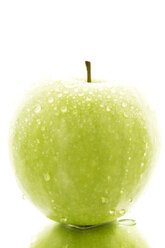 Granny smith with water drops on white background, close up - MAEF005859