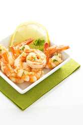 Plate of prawns on white background, close up - MAEF005917