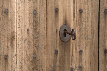 Germany, Wooden door with key in keyhole, close up - ASF004861