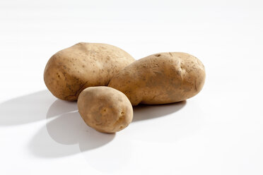 Raw potatoes on white background, close up - CSF017661