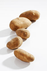 Raw potatoes on white background, close up - CSF017660