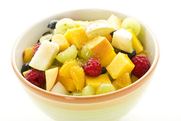 Bowl of fruit salad on white background, close up - MAEF006123
