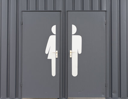 Germany, Male and female sign on toilet door - HLF000109